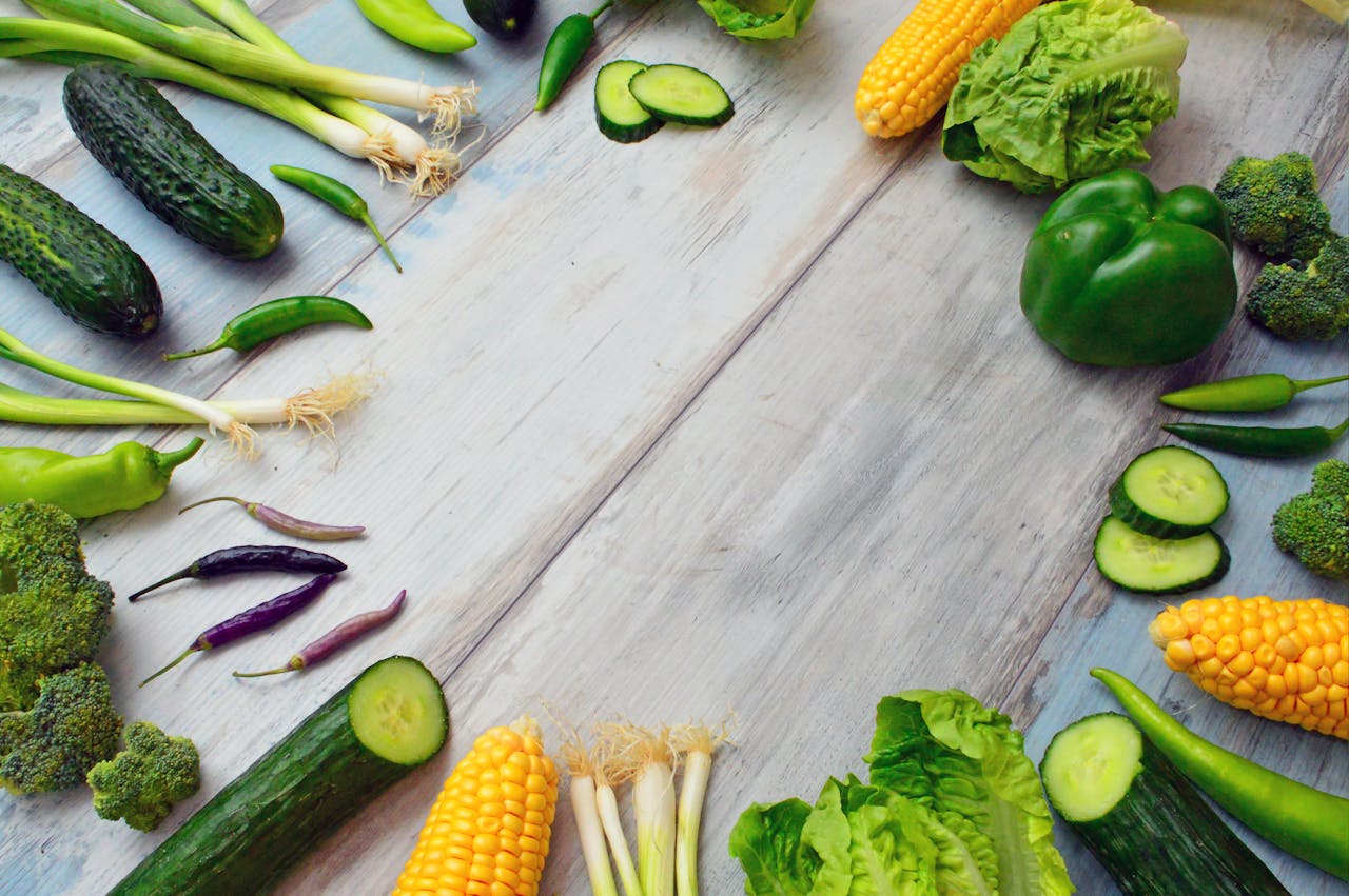 services-01 An assortment of fresh vegetables on a wooden table, perfect for healthy cooking.